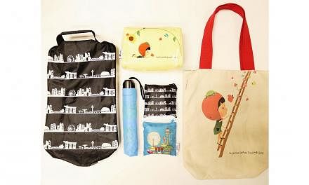 A set of six exclusive premiums designed by local designers Wang Shijia and Jo Soh. The set comprises (clockwise from top) a cosmetics pouch, a canvas tote bag, foldable shopping bags, a foldable umbrella and a shoe bag. -- PHOTO: CHANGI AIRPORT GROU