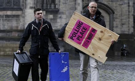 Ballot boxes are carried across West Parliament Square in Edinburgh Scotland, Britain&nbsp;on May 6, 2015. Britons voted on Thursday in a knife-edge general election that could put their country’s membership of the European Union in question and ra