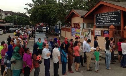 Polls for the Permatang Pauh parliamentary by-election opened at 8am on Thursday with voters lining up from very early to cast their ballots. -- PHOTO: THE STAR/ASIA NEWS NETWORK