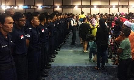 Family members welcome back 126 Home Team officers at Changi Airport Terminal 2 on Saturday. Some 126 Home Team officers returned home on Saturday evening to a rousing welcome after spending two weeks carrying out rescue operations in earthquake-hit 