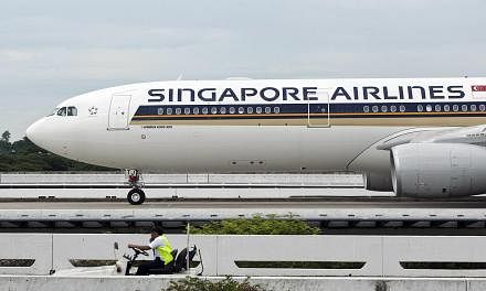 Singapore Airlines (SIA) has partnered the Singapore National Olympic Council (SNOC) as the official airline partner for Team Singapore until the end of April 2018 in the first such partnership of its kind. -- PHOTO: BLOOMBERG