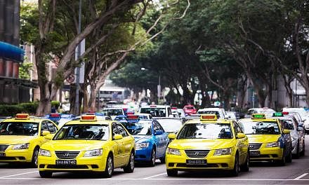 The Government this week stepped in to regulate the growing sector of third-party taxi booking services, promising to safeguard the interest of commuters while also allowing space for the nascent industry to innovate and expand. -- PHOTO: BLOOMBERG&n