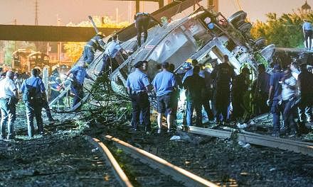 Emergency responders search for passengers following an Amtrak train derailment in the Frankfort section of Philadelphia, Pennsylvania, May 12, 2015.&nbsp;Search teams have recovered the black box from an Amtrak train that derailed in Philadelphia an