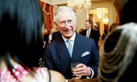 Britain's Prince Charles greets guests at a reception for him and his wife Camilla, Duchess of Cornwall, at the British Ambassador's residence in Washington on March 17, 2015. Prince Charles wrote to ministers on issues ranging from resources for Bri