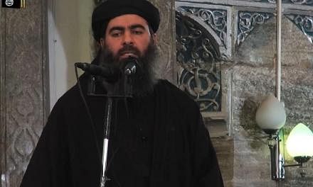 A file image grab from a propaganda video allegedly shows the leader of the Islamic State militant group, Abu Bakr al-Baghdadi. On May 14, 2015, Baghdadi urged Muslims to emigrate to his self-proclaimed "caliphate", in the jihadist supremo's first au