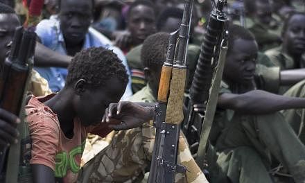 A February 2015 file photo shows child soldiers at a disarmament ceremony in South Sudan.&nbsp;Armed groups in strife-torn Central African Republic released 350 child soldiers Thursday, honouring a deal signed with Unicef, the United Nations children