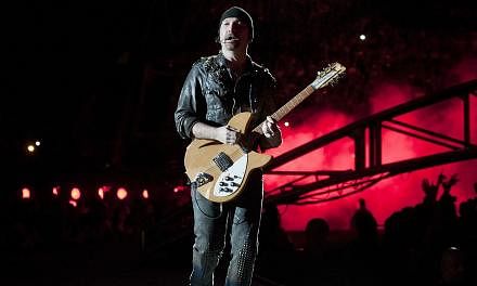 U2 guitarist The Edge (above, in a 2011 file photo) apparently did not see the part of the stage that is his own namesake as he tumbled on the first night of the veteran Irish rockers' tour. -- PHOTO: AFP