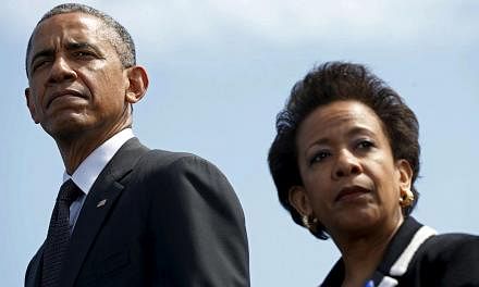 US President Barack Obama and US Attorney-General Loretta Lynch attend the 34th annual National Peace Officers' Memorial Service at the US Capitol in Washington on May 15, 2015. -- PHOTO: REUTERS