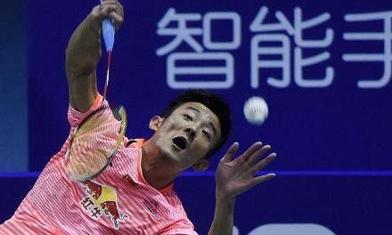 China's Chen Long hits a return against Indonesia's Jonatan Christie during their men's singles semi-final match of the 2015 Sudirman Cup on May 16, 2015. -- PHOTO: AFP&nbsp;