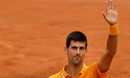 Novak Djokovic of Serbia celebrates after winning against David Ferrer of Spain on May 16, 2015 in Rome. -- PHOTO: AFP