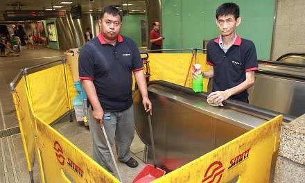 Bizlink managed to find higher-paying jobs such as cleaning escalators at MRT stations for clients like Zali Samat (left) and Kwok Yeow Seng. Madam Seng Siew Thim, 53, and her brother Seng Beng Tee, 49, recycling headsets at a Minds workshop.