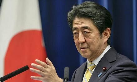 Japan's Prime Minister Shinzo Abe speaking at a news conference at his official residence in Tokyo, Japan, on May 14, 2015. -- PHOTO: EPA