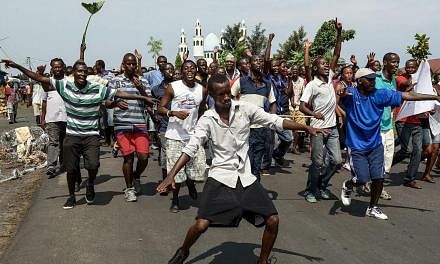 Protestors opposed to the Burundian president's bid for a third term march through the Nyakabiga neighborhood of Bujumbura on May 19, 2015. -- PHOTO: AFP&nbsp;