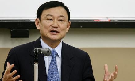 Thailand's fugitive former prime minister Thaksin Shinawatra said on Tuesday he had no plans to mobilise his "red shirt" supporters, but called the first year of the junta government that came to power in a coup "not so impressive". -- PHOTO:&nbsp;BL