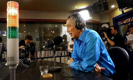PM Lee Hsien Loong speaking on Capital 95.8 FM's live weekly programme On Air With Minister last night, where he urged Singaporeans not to take their votes lightly.
