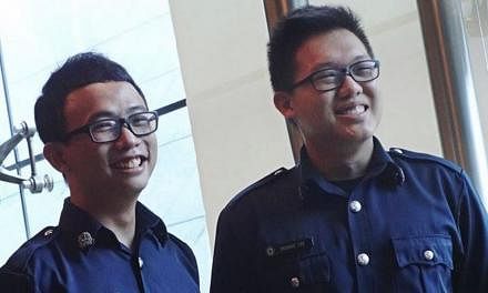 A woman managed to land her molester in jail, thanks to the quick actions of two off-duty police officers SC Tan Keng Yew (left) and SC George Lee. -- PHOTO: SINGAPORE POLICE FORCE