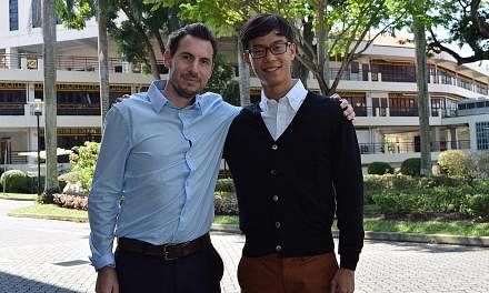 Angus Ross Prize winner Raymond Scott Lee Chian Hoong (right) with his literature teacher of two years, Mr Christian Simpson. -- PHOTO: HWA CHONG INSTITUTION&nbsp;