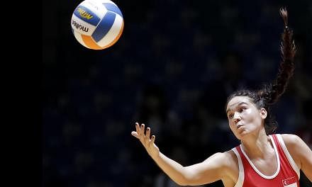 Shelby Koh in action as&nbsp;Singapore got off to a winning start in the SEA Games netball competition with a resounding 72-21 win over Brunei on Sunday. -- PHOTO: REUTERS