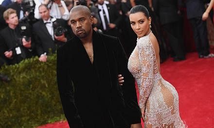 Kanye West (left) and Kim Kardashian at the Metropolitan Museum of Art on May 4, 2015 in New York City. The married couple is expecting their second child. -- PHOTO: AFP