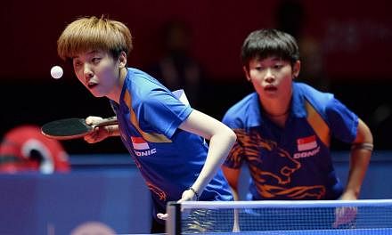 Singapore got its first gold medal at the 28th SEA Games from Lin Ye and Zhou Yihan, who won the table tennis women's doubles on Tuesday night. -- PHOTO: REUTERS&nbsp;