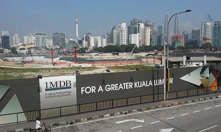 Malaysia's central bank said on Wednesday it had launched a "formal inquiry" into strategic development fund 1Malaysia Development Bhd (1MDB), which is struggling under a huge debt burden and suspicions of massive fraud and mismanagement. -- PHOTO: S