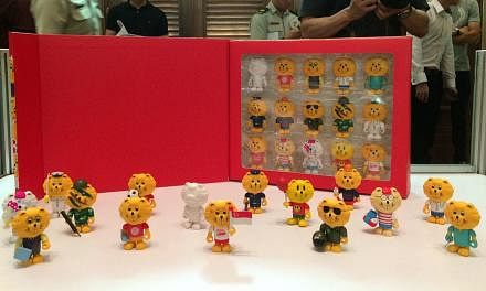 Commemorative figurines of Singa the Lion which come in 15 different designs. --&nbsp;ST PHOTO: KEVIN LIM