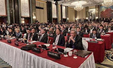 Defence ministers and delegates listening to US Secretary of Defence Ashton Carter at the Shangri-La Dialogue in Singapore on May 30, 2015. -- PHOTO: AFP&nbsp;