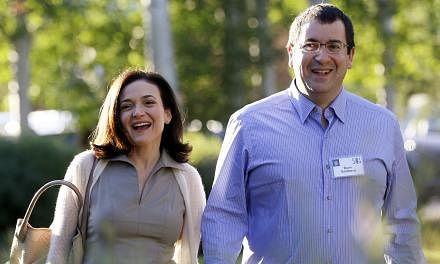 Chief Operating Officer (COO) of Facebook Sheryl Sandberg (left), with her husband David Goldberg, CEO of SurveyMonkey, at a media conference in Sun Valley, Idaho on &nbsp;July 9, 2014. -- PHOTO: REUTERS