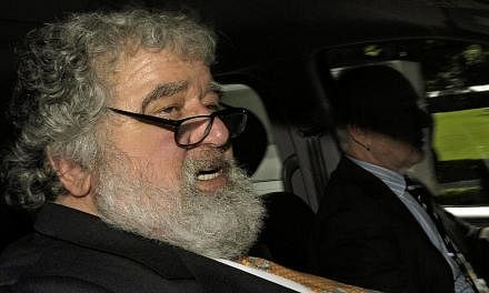Fifa official Chuck Blazer leaving the Fifa headquarters in Zurich, Switzerland, after an ethics hearing over alleged corruption during the campaign for the Fifa presidency on May 29, 2011. -- PHOTO: EPA