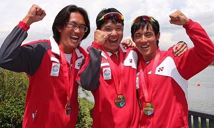 (From left) Gold medalists Lucas Teo, Bill Lee and Brandon Ooi with their medals. -- ST PHOTO: NEO XIAOBIN