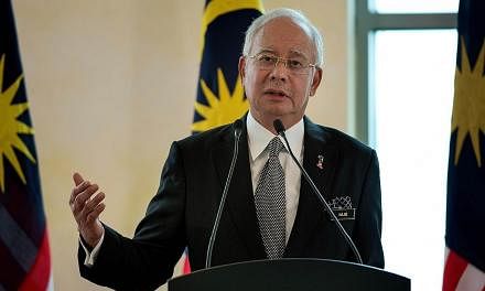 Malaysian prime minister Najib Razak, who is on a visit to Saudi Arabia, has been monitoring the search and rescue efforts following the earthquake that struck Mount Kinabalu. -- PHOTO: AFP