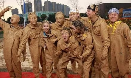 Left: Vicki Zhao (second from left) plays a high-flying marketing executive who takes time off the rat race to get her daughter into a good primary school. Below: Stars caked in mud in the Chinese Running Man.