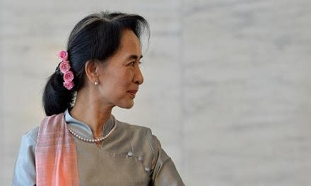 Myanmar's ruling party on Thursday released a draft bill on changes to its junta-era constitution that could end an effective army veto on charter amendments, but still bars opposition leader Aung San Suu Kyi from the presidency. -- PHOTO: AFP&nbsp;