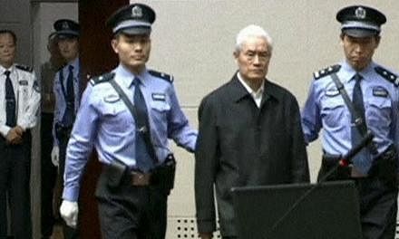 China's former domestic security chief Zhou Yongkang being escorted into court for his sentencing in Tianjin, China, in this still image taken from video provided by China Central Television and shot on June 11, 2015. -- PHOTO: REUTERS