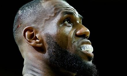 A cut on the head of LeBron James of the Cleveland Cavaliers is seen in the second quarter against the Golden State Warriors during Game Four of the 2015 NBA Finals at Quicken Loans Arena on Thursday (June 11). -- PHOTO: AFP