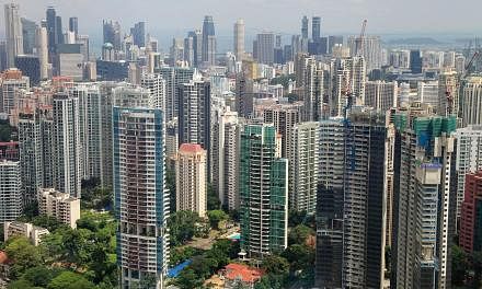 Residential buildings stand in the Grange Road area of Singapore. Buyers with HDB addresses are opting for smaller apartments when they venture into the private housing market, according to DTZ Research. -- ST PHOTO: BLOOMBERG