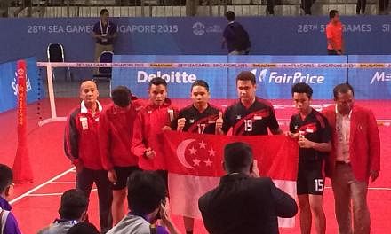The Singapore men's sepak takraw team clinched their first medal in over two decades with a silver in the final men's regu match on June 13, 2015. -- ST PHOTO: LIM CHING YING