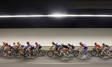 Cyclists along Marina Bay South in the SEA Games men's road race on June 14, 2015. -- PHOTO: SINGAPORE SEA GAMES ORGANISING COMMITTEE/ACTION IMAGES VIA REUTERS