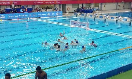 The Republic's men's water polo team sealed their 26th consecutive gold with a hard-fought 15-10 win over Indonesia on Tuesday (June 16) afternoon at the OCBC Aquatic Centre. -- ST PHOTO: ISAAC NEO