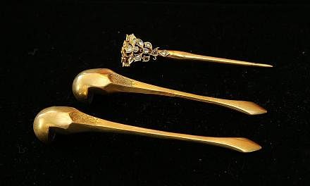 (Left) A kerosang centrepiece with a deer motif that is estimated to have been made in the late 1800s. (Left below) These earrings are estimated to be made around the mid-1900s from 20K gold with rose-cut diamonds. A hairpin set which belonged to Mr 
