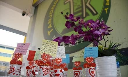(Left) Messages penned by the sister of victim Navdeep Singh Jaryal Raj Kumar at Tanjong Katong Primary School, which held a memorial ceremony yesterday. (Above) A soccer event for another victim, Ameer, involving some 60 people, including his footba