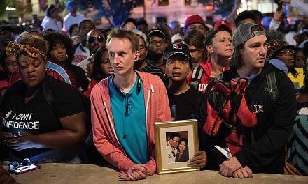 People queueing yesterday for tickets to attend boxing legend Muhammad Ali's funeral service in Louisville, Kentucky, tomorrow. He died last week after a decades-long battle with Parkinson's disease.