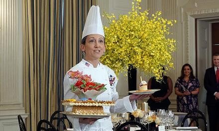Executive pastry chef Susie Morrison with her desserts for the state dinner. Called "A Festive Gathering", the desserts have a motif of orchids and roses.