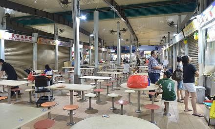 The food centre at Block 117, Aljunied Avenue 2 yesterday. Business in the Sims Drive and Aljunied Crescent area has suffered since the Zika outbreak.