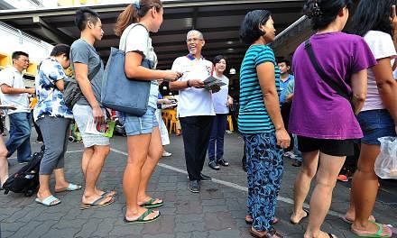Mr Masagos (centre) making his rounds in Tampines earlier this month during outreach efforts on the Zika threat. In Parliament yesterday, the minister cited several factors contributing to Singapore's vulnerability to mosquito-borne infections, inclu