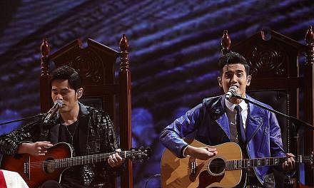 LEFT: Nathan Hartono (right) performing with his mentor Jay Chou at the Sing! China final yesterday. The Singaporean picked two of his mentor's classics - singing the Nunchucks rap hit with Chou and the Longest Movie ballad by himself. RIGHT: Winner 