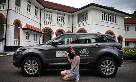 SPH Editorial Projects Unit brand manager Priscilla Tan with the Range Rover Evoque at UBS Business University Asia Pacific. Finalists of The Straits Times Singaporean of the Year 2016 will arrive in style for the award ceremony in Land Rovers and Ja