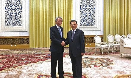 DPM Teo (left) meeting Mr Zhao Leji, head of the Organisation Department of the Chinese Communist Party (CCP), with whom he chairs the Leadership Forum, yesterday at the Great Hall of the People. Mr Teo, who is also Coordinating Minister for National