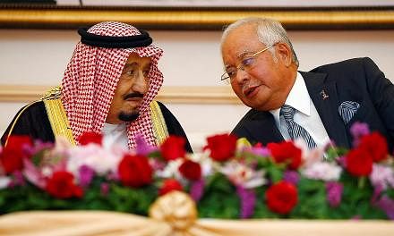 King Salman and Prime Minister Najib at a ceremony yesterday to mark the signing of memorandums for cooperation on economic, labour, science and education issues.