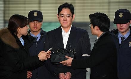 Samsung Group leader Lee Jae Yong arriving for questioning at a special prosecutor's office in Seoul last month. He has been charged with bribery, embezzlement and other offences.